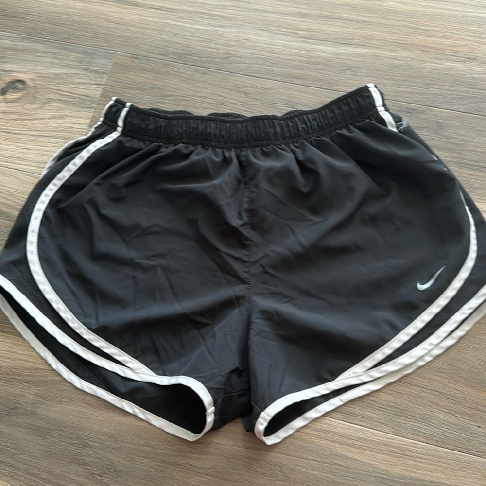 Grey Nike shorts with white lining.